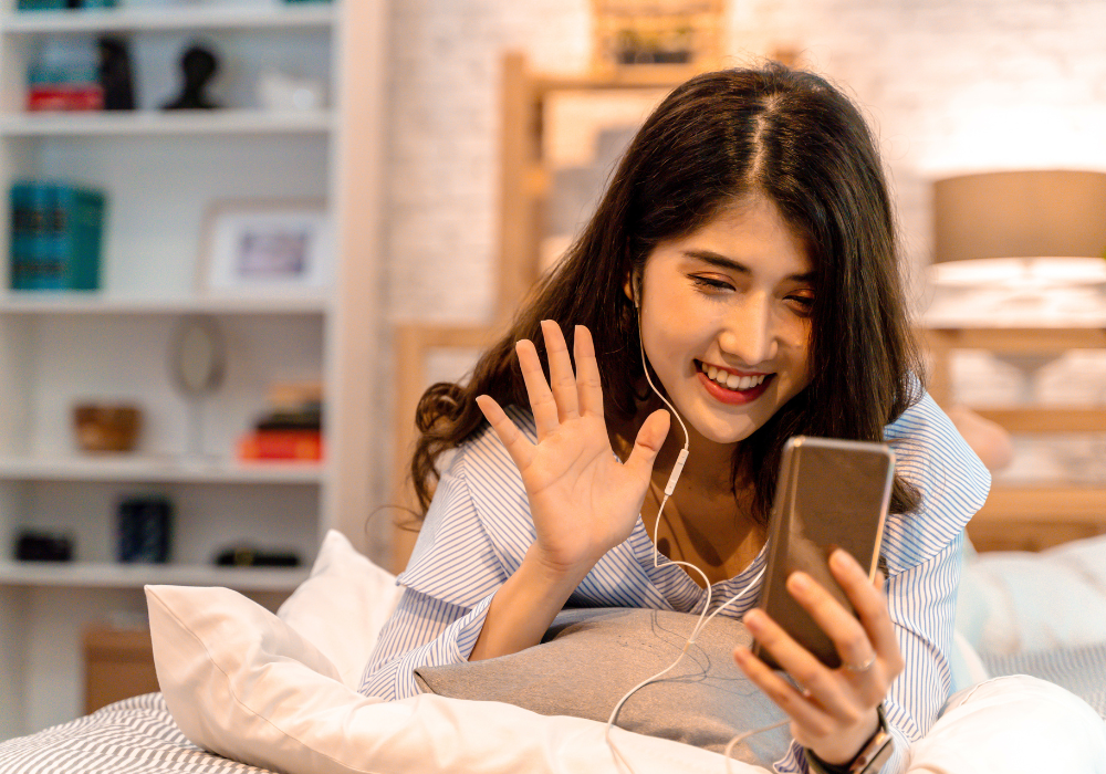 girl-facetime-gallery Study abroad student Facetiming family from dorm room