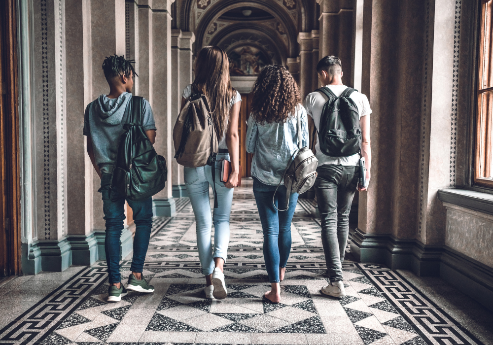 hallway-study-abroad-students-gallery Four students walking through hallway to their study abroad program