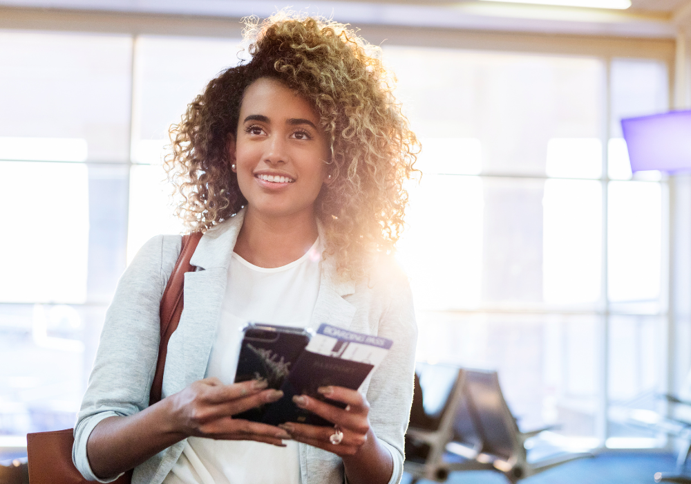 holding-passport-in-aiport-gallery Student with travel documents in airport