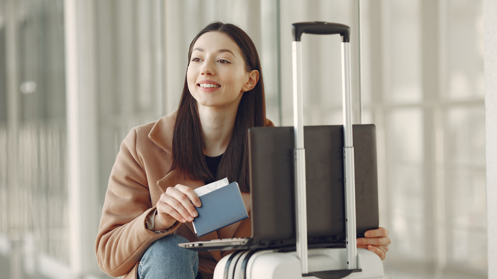 Student crouched in the airport with their passport