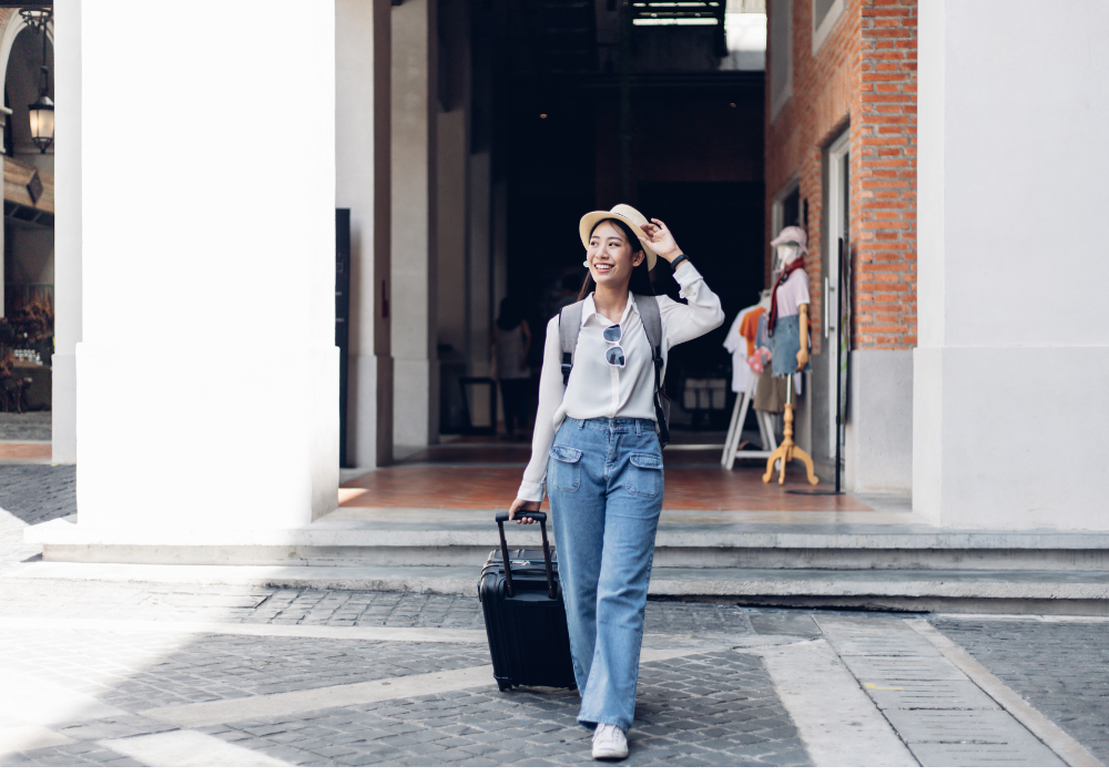 student-dragging-luggage Study abroad student arriving with suitcase