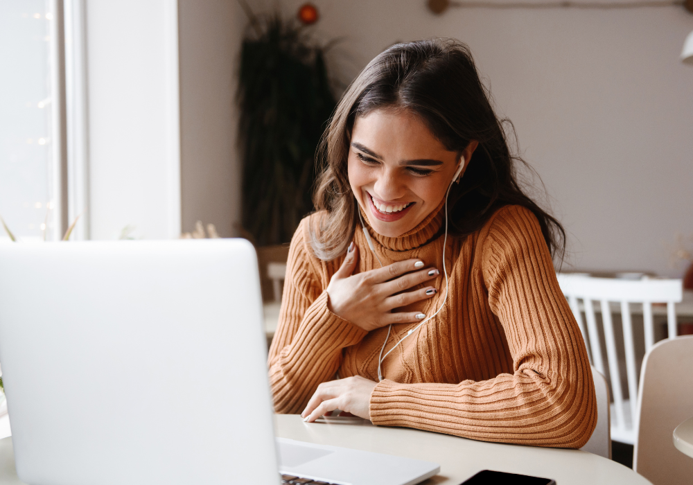 student-facetime-orange-sweater-gallery Study abroad student video chatting from their study abroad program