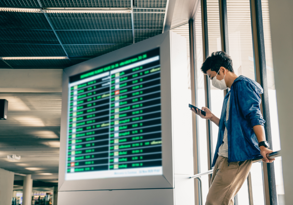 student-leaning-airport-gallery Student checking status of his study abroad flight
