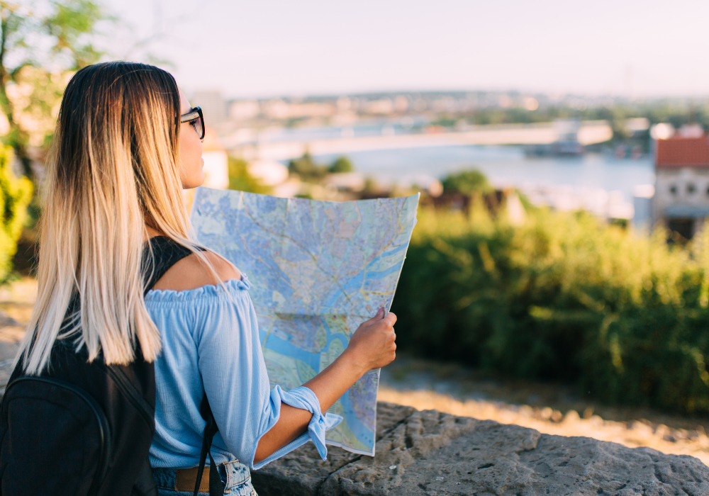 student-looking-at-map-gallery Student looking at cityscape and map