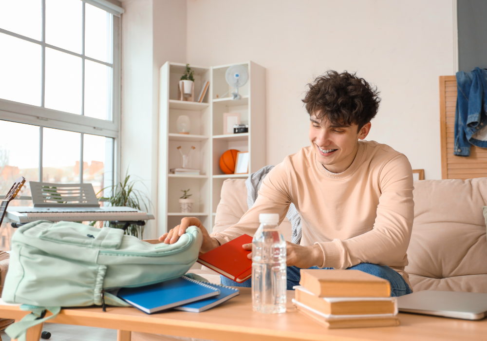 student-packing-backpack-gallery Study abroad student packing his backpack