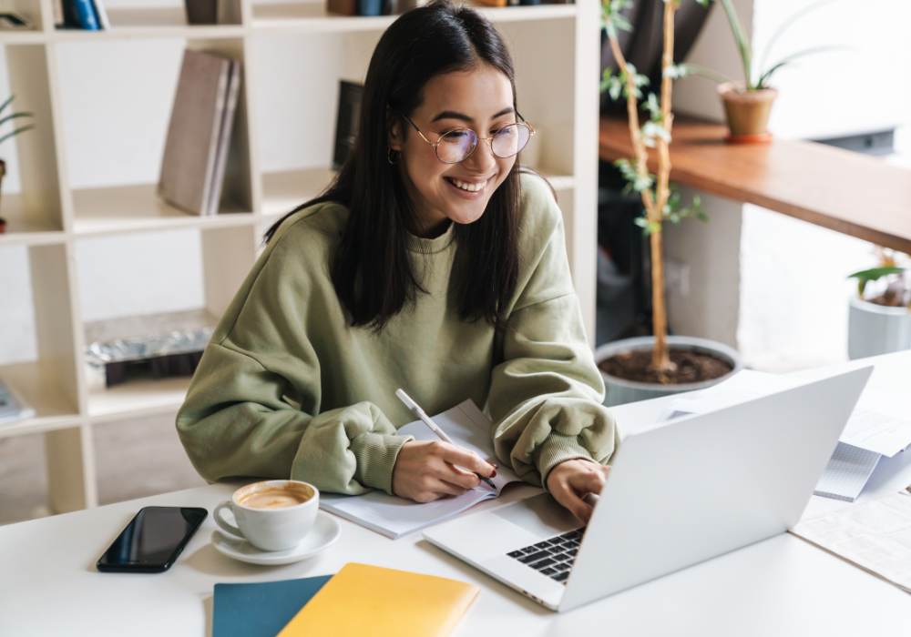 student-smiling-at-computer-gallery
