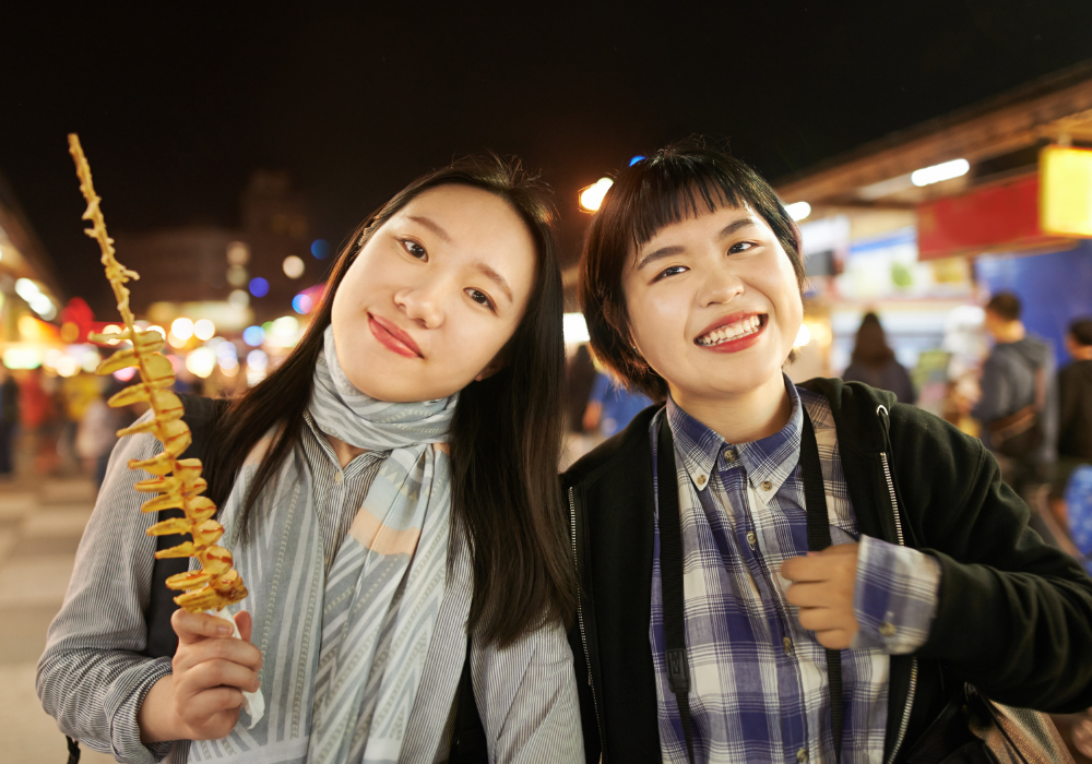 students-eating-gallery Two students enjoying local street food