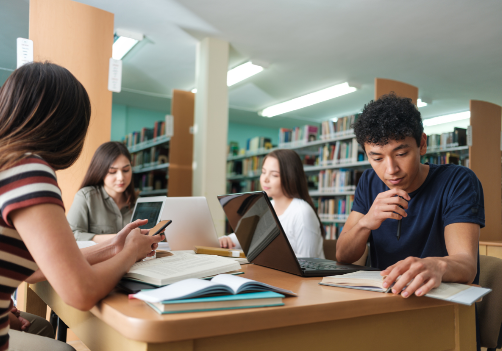 students-in-library-gallery Study abroad students learning the benefits of studying abroad in a library