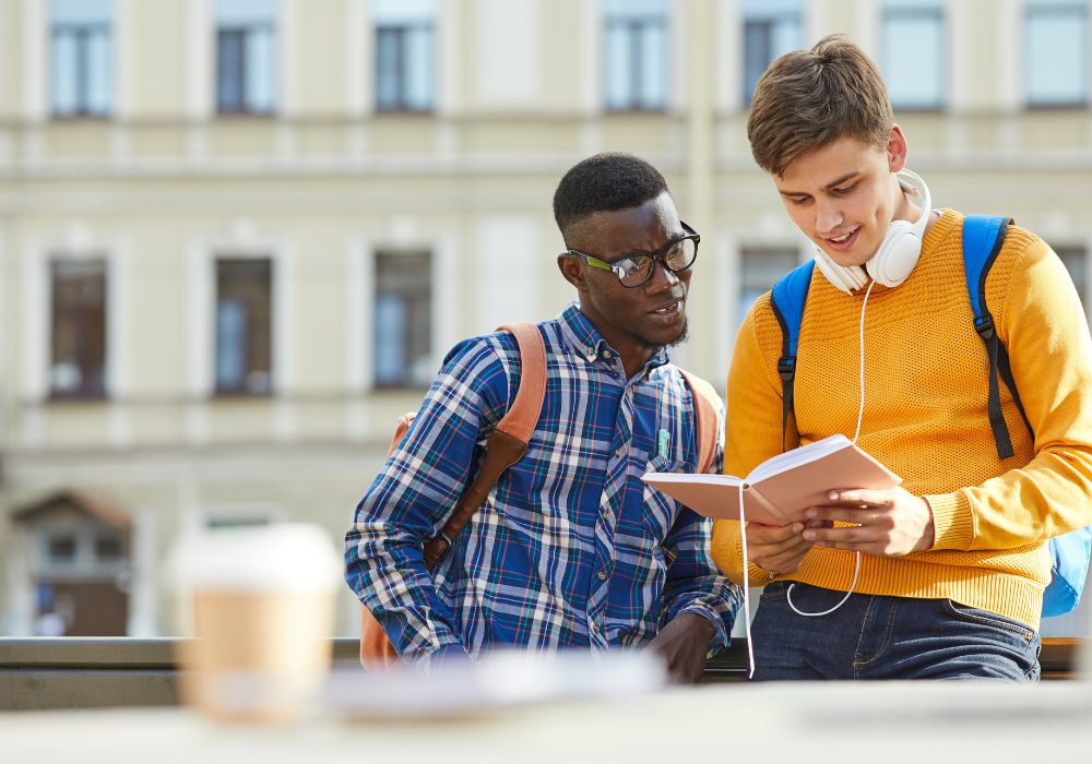 students-looking-at-book-gallery