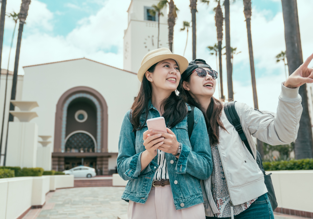 students-pointing-gallery Study abroad students walking around the city together