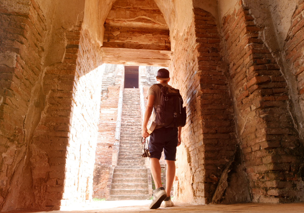 tunnel-traveler-gallery Study abroad student wandering through monument ruins