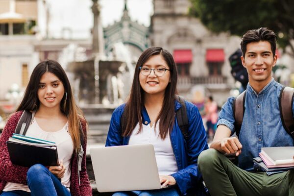 morocco support image-208 Three young individuals seated on a bench.