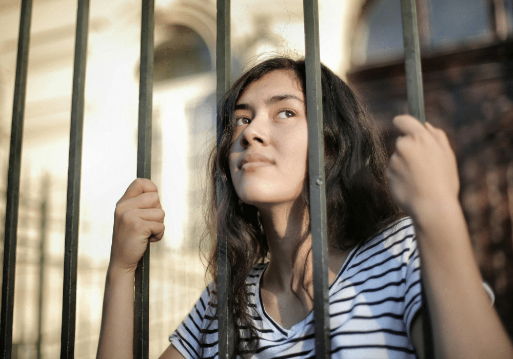 Introverted student looking outside the school quietly while abroad.
